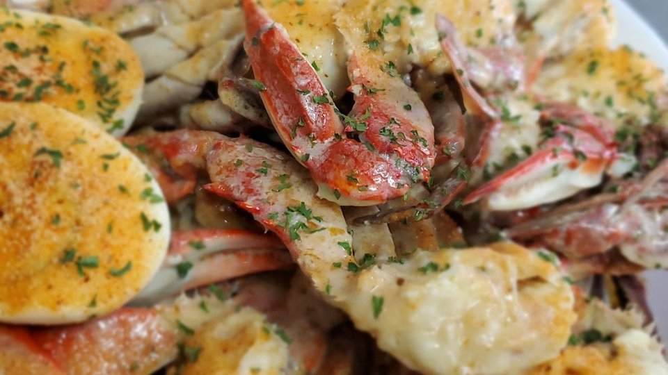 Crab legs served with garlic butter.